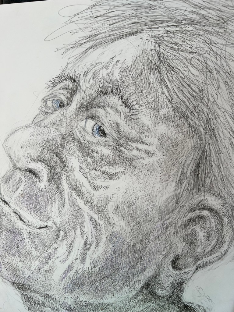 Black and white drawing of a man's face with blue eyes looking upward